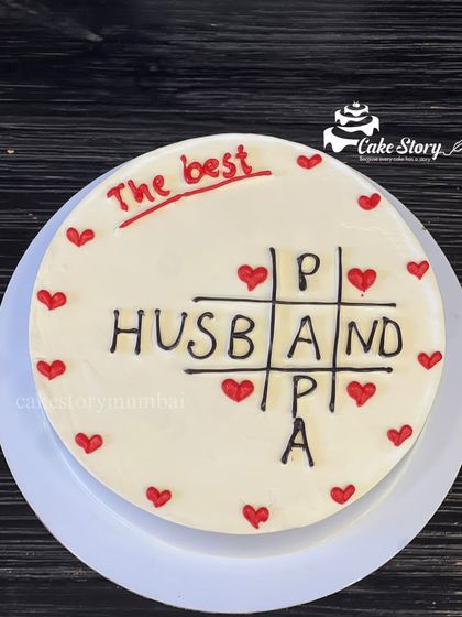 A thoughtful cake celebrating the best Husband and Papa. This simple design uses a tic-tac-toe format to show he wins at both roles.