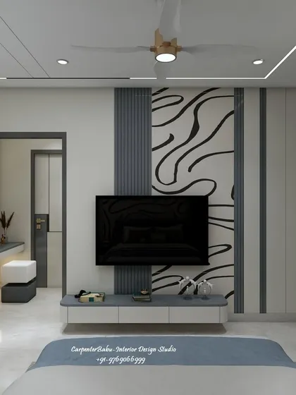 The TV unit is set against the abstract mural, creating a dynamic and artistic focal point in the bedroom.