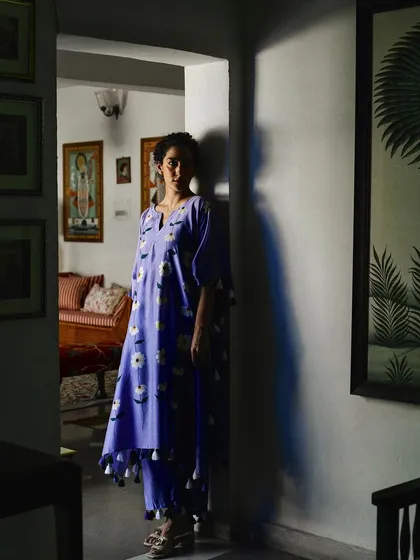 Using dramatic shadows to create a moody and artistic portrait for Baavli. The model stands in a doorway, half in light and half in shadow, adding a layer of mystery and depth to the image.