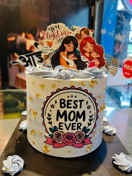 A "Best Mom Ever" cake decorated with loving messages and illustrations, perfect for Mother's Day or her birthday.