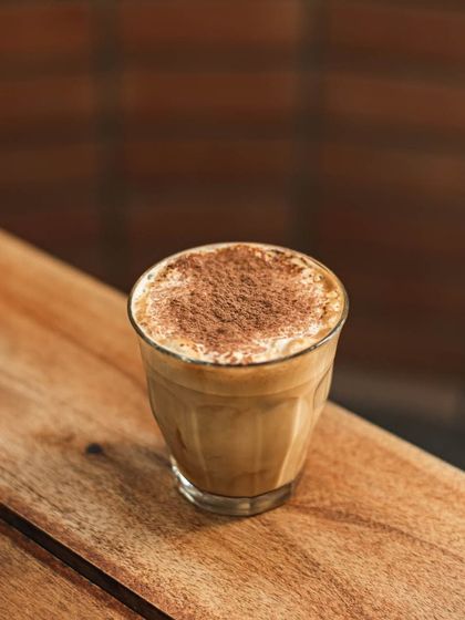 Another look at our cocoa-dusted coffee, a warm and comforting beverage.