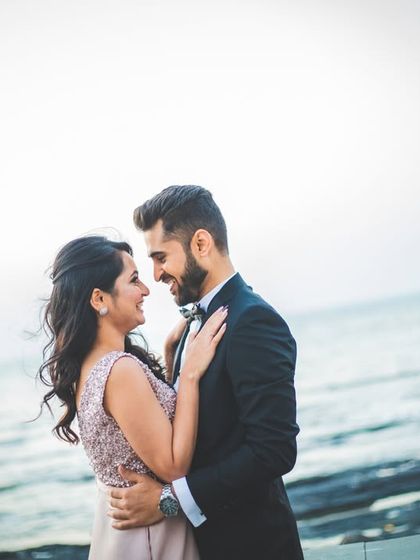 A beautiful wide shot of the couple against the sea, taken just before their cocktail party. We love using natural landscapes for stunning portraits.