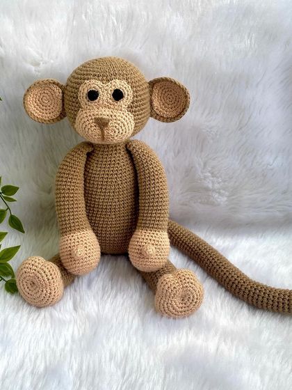 A playful monkey with a long tail, perfect for swinging around. This is my own custom design, and he's ready for lots of jungle adventures.