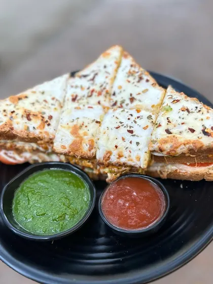 My Melting Sandwich is a cheesy delight, served with our signature green chutney and ketchup.