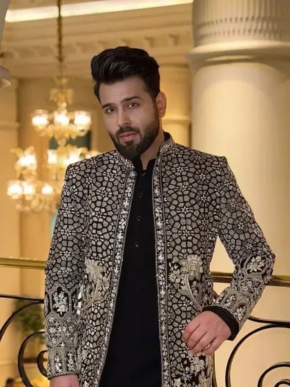 Another angle of the black and silver embroidered sherwani, showing how it catches the light.