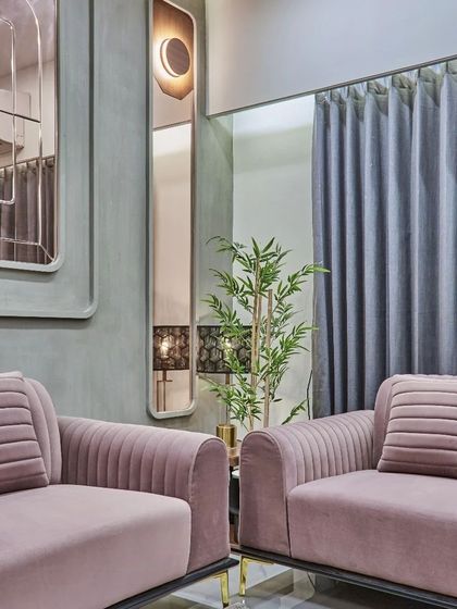 A vertical mirror with an integrated light fixture adds a touch of art deco elegance and helps to visually heighten the space.