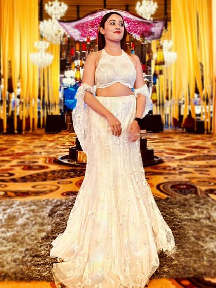 An all-white ensemble for a social event in Ludhiana. The delicate lacework and flowing sleeves gave it an ethereal, angelic vibe.