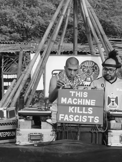 A black and white shot of me and Delhi Sultanate playing a BFR Sound System session. The sign "This Machine Kills Fascists" speaks to the political and cultural roots of the sound system culture we represent.