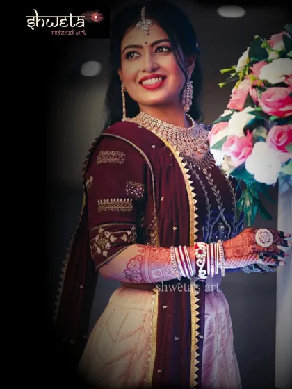 A stunning professional photo of one of my brides. Her beautiful mehendi is perfectly complemented by her reception outfit, showcasing how henna completes the bridal look.