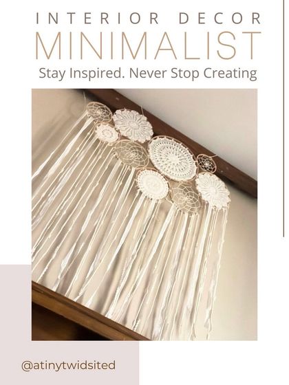This minimalist cluster dreamcatcher is perfect for a nursery or kids' room. The clean white and natural wood tones create a serene and calming piece of decor.