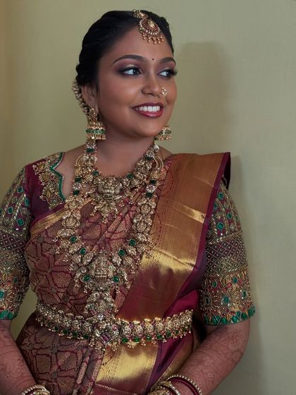 Another beautiful angle of Prithivi's bridal look. Her expression is serene, and the makeup highlights her features with a touch of shimmer on the eyes and a classic lip colour.