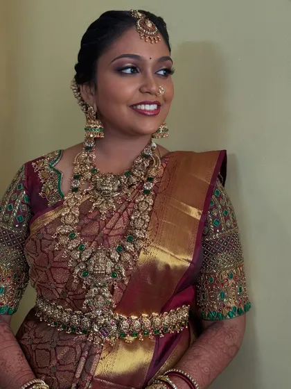 Another beautiful angle of Prithivi's bridal look. Her expression is serene, and the makeup highlights her features with a touch of shimmer on the eyes and a classic lip colour.