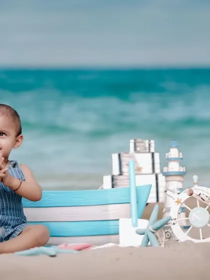 From the park to the beach, I love finding the perfect backdrop for your family's story. This nautical-themed beach shoot was a joy, capturing a little sailor's happy claps against the backdrop of the sea.