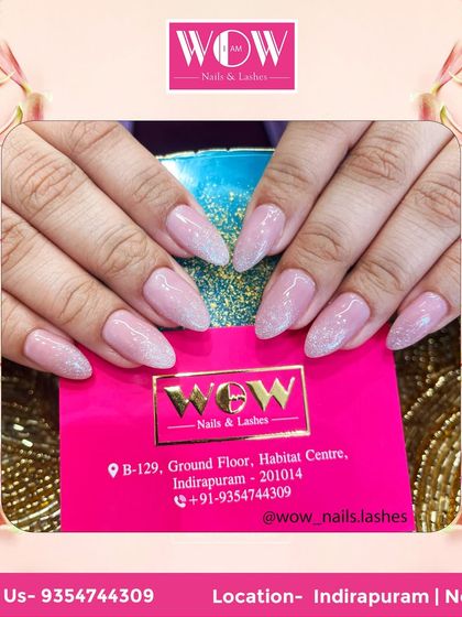 These almond-shaped extensions feature a soft pink glitter base, creating a look that is both subtle and sparkling. It's a versatile style that's perfect for any occasion.