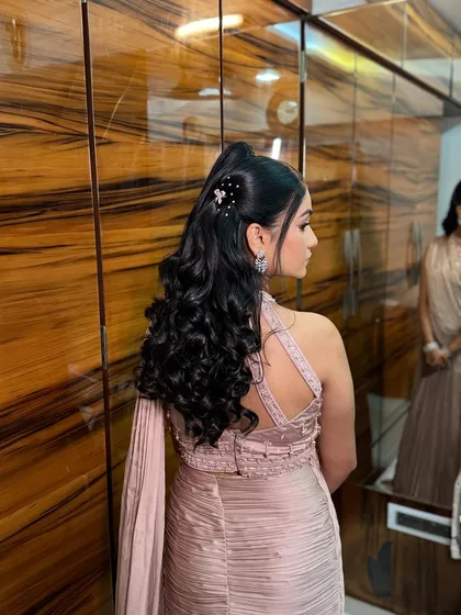 Another angle of this chic high ponytail, showing off the volume and the delicate hair accessories.