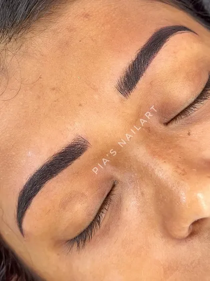 This is a perfect example of Combination Brows. I've mixed microblading hair strokes at the front of the brow with soft, ombre powder shading through the arch and tail. This technique gives you the best of both worlds: the natural look of hair strokes and the defined, filled-in appearance of powder brows.