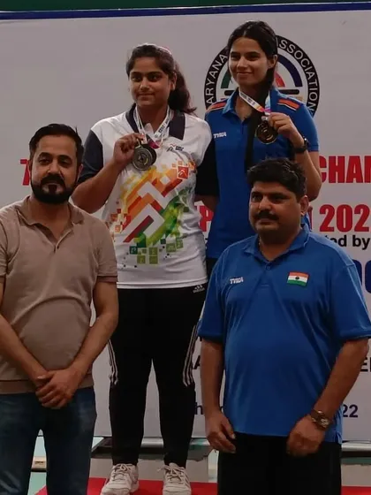 With the top two medalists of a women's shooting event. Their performance was outstanding throughout the competition.