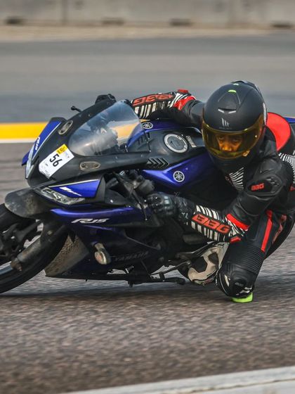 Setting the tone. A rider on a Yamaha R15 demonstrates excellent knee-down form during a session at Buddh International Circuit.