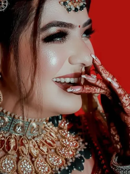 A candid, joyful moment. The bride's smile is infectious, and her jewellery adds to the festive sparkle.