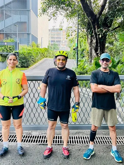 Three of our members, a mix of runners and cyclists, posing together. Our club brings together different kinds of fitness enthusiasts.