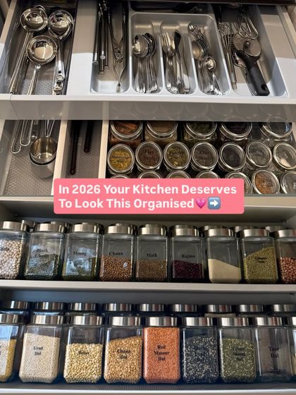 A complete kitchen system in one view. It shows organized drawers for cutlery and spices, as well as cabinets for decanted grains.