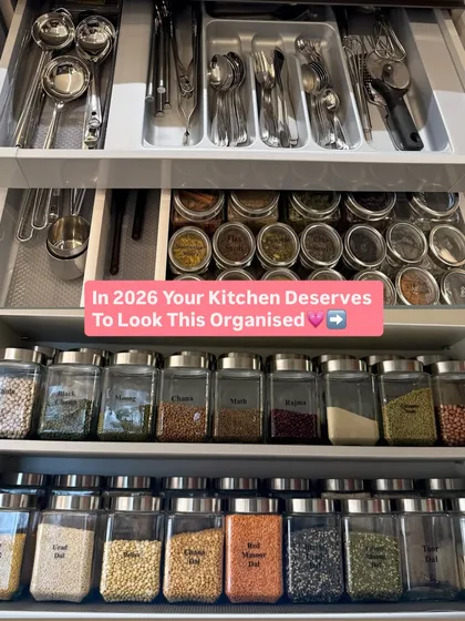 A complete kitchen system in one view. It shows organized drawers for cutlery and spices, as well as cabinets for decanted grains.