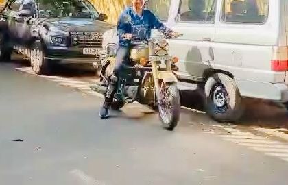 A student practices a slow-speed turn, a crucial skill for city riding. My guidance helps her navigate the maneuver smoothly and safely.