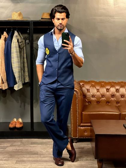 For a different kind of formal, we offer tailored waistcoats. This blue pinstripe waistcoat and matching trouser set is perfect for a smart, layered look without a jacket.