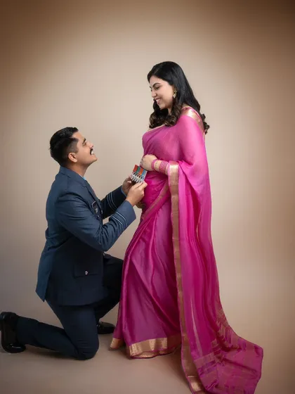 A moment of pride and love. An Indian Air Force officer honors his wife and their unborn child in this powerful and emotional portrait. The blend of uniform and traditional saree tells a unique family story.
