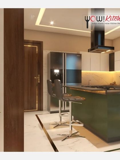 A different perspective of the olive green island kitchen, showing the breakfast bar with stylish high chairs and the seamless flow of the design, perfect for modern living.