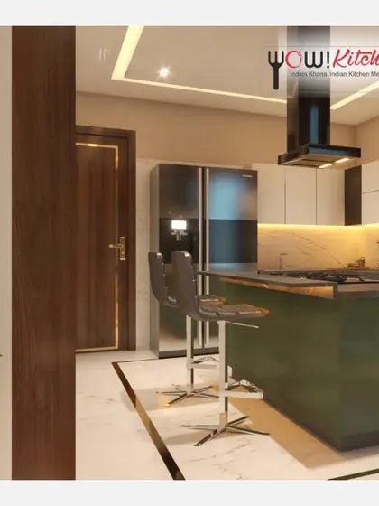 A different perspective of the olive green island kitchen, showing the breakfast bar with stylish high chairs and the seamless flow of the design, perfect for modern living.