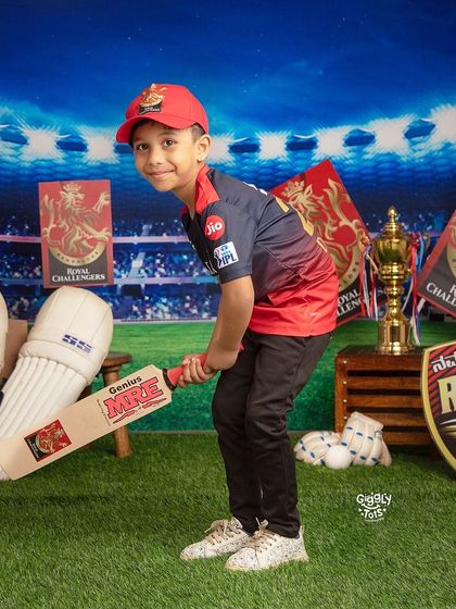 All the best, RCB! A young fan strikes a pose, ready to cheer his team to victory.