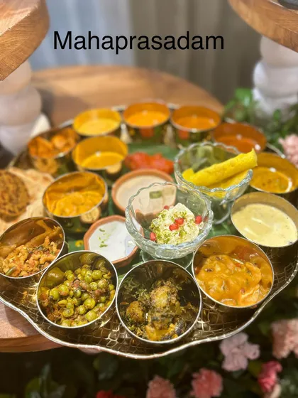 A traditional Mahaprasadam thali served at the Tirupati Balaji Temple event. This platter features a wide variety of authentic vegetarian dishes, showcasing my ability to cater to religious and cultural events.