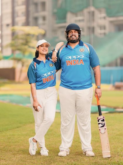Posing with confidence and a shared love for the game. This portrait showcases the couple in their element, blending their passion for cricket with their pre-wedding celebration.