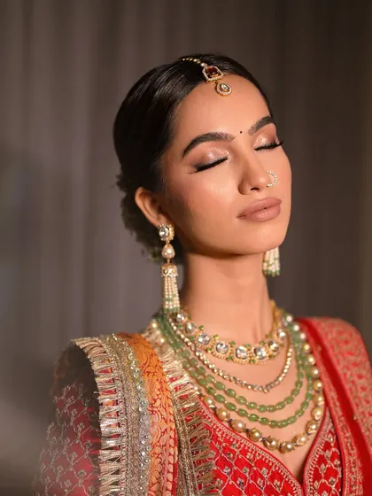 A close-up of a modern bridal makeup look. I used soft, warm brown tones on the eyes with a shimmer finish, complemented by a clean winged liner to create an elegant and timeless feel perfect for a wedding ceremony.