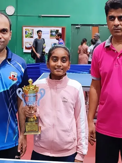 Mahika Susvirkar with her coaches and her runner-up trophy in the U-11 Girls category at the 2nd District Ranking tournament.