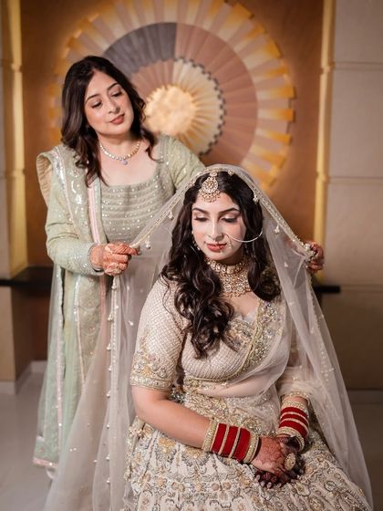 The final touches from a loving mother before the Anand Karaj ceremony. These are the moments that make a wedding day so memorable.