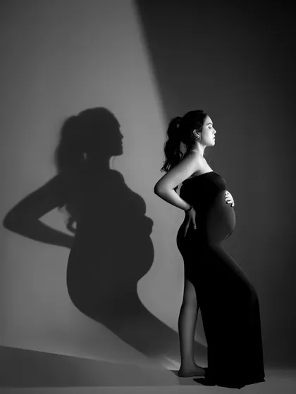 A creative use of shadow and light to create a double-silhouette effect, adding an artistic layer to the portrait.