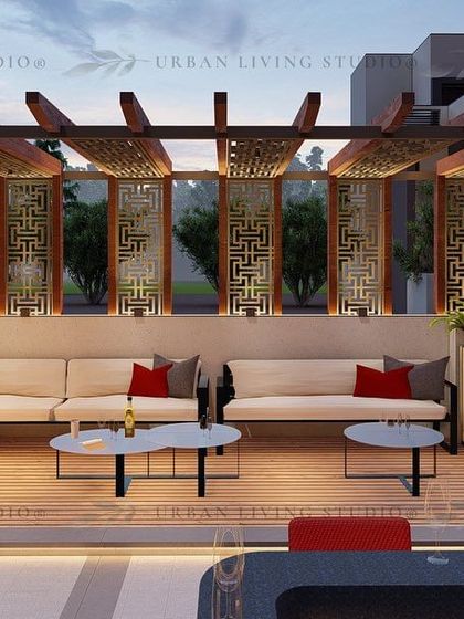 A large L-shaped sofa under a pergola with decorative jaali panels. This design is perfect for hosting larger groups in a stylish and comfortable setting.