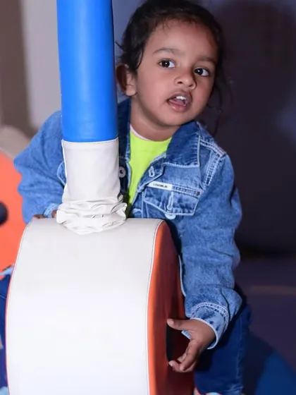 Exploring the soft play structure. The padded poles and soft surfaces are designed to keep kids safe as they climb and play.