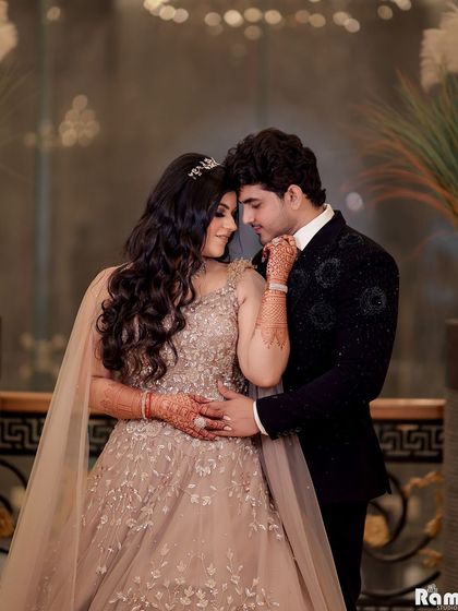 An intimate portrait of a couple on their engagement night. The soft lighting and their close embrace highlight the emotion and connection of this milestone moment.