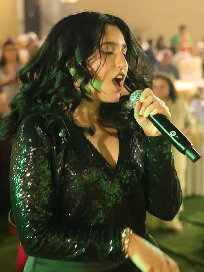 A close-up shot capturing the emotion of a performance. We pour our hearts into every song, whether it's a high-energy track or a soulful ballad.