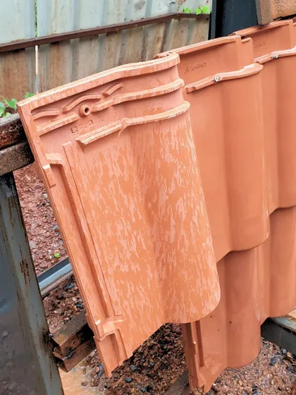 A close-up of the red mission tiles used for the Tellado Villas roof. These locally sourced tiles are not only sustainable but also deeply connected to the architectural heritage of Goa, reflecting the region's history and climate.