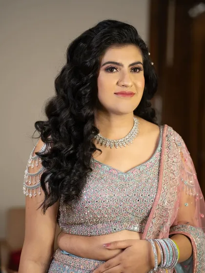 This engagement bride is glimmering like a dream. Her makeup is soft and glowy, with beautifully styled hair and a radiant complexion.