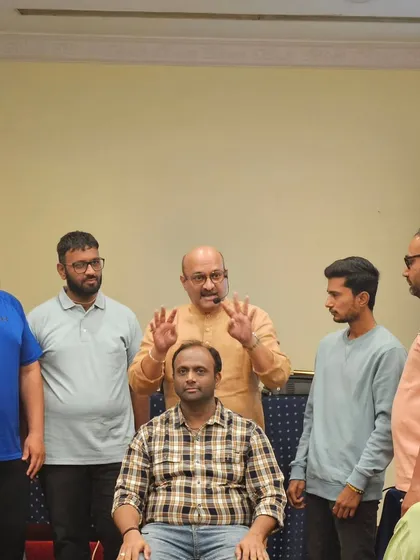 A group of participants on stage during a practical exercise at the Sanjivani workshop. Group activities help amplify the collective energy and enhance the learning experience.