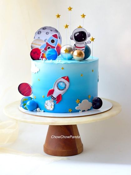 A full shot of the astronaut and rocket ship cake, ready for a birthday blast-off.