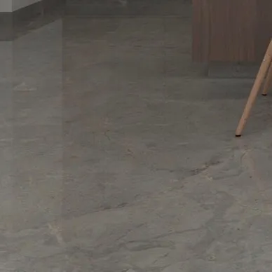 Detail of the proposed grey marble flooring, showing its subtle veining and polished finish.