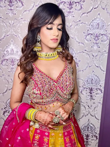 A close-up showing the intricate details of her blouse and the soft, glowing makeup.