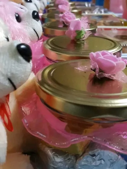 This affordable baby birthday return favor includes a mix of treats and a cute teddy bear. The jars are filled with my assorted handmade chocolates.