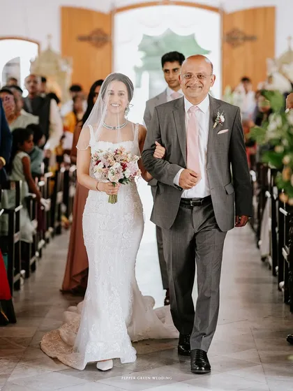 A father proudly walks his daughter down the aisle. This is one of the most emotional and significant moments of a wedding day, a story of family, love, and new beginnings.